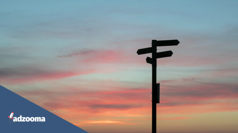 A silhouette of a signpost